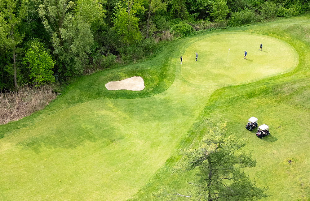 Aerial golf course photography green putt